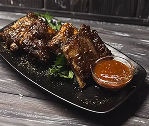 Свинячі ребра BBQ з меню клубу «Охота»